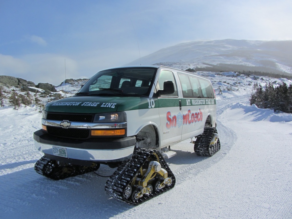 A Snow Coach climbs Mouth Washington in wintertime.